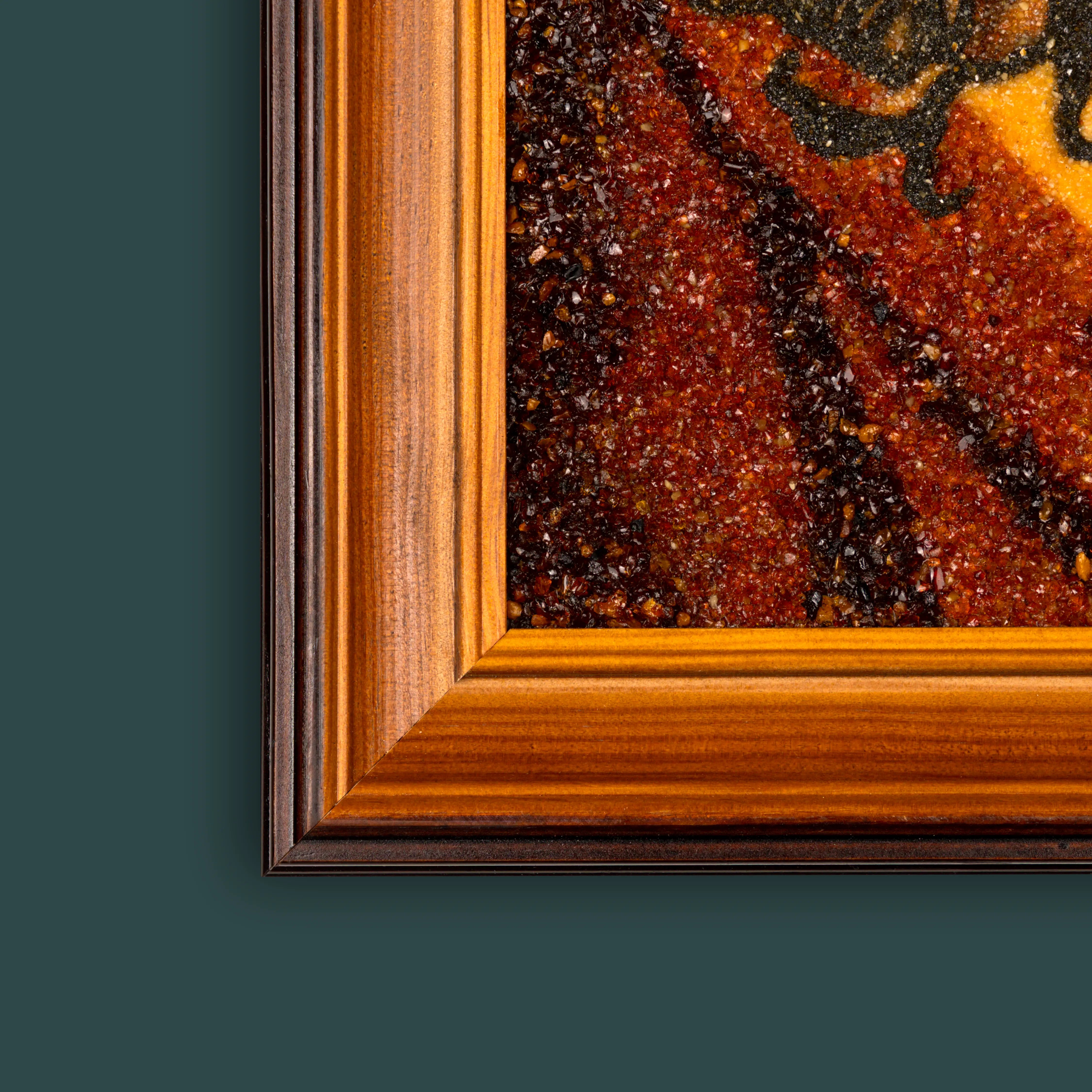 Corner close-up of BalticBliss genuine amber artwork with natural wood frame and rich textured Baltic amber stones, showcasing fine Lithuanian craftsmanship and authentic handmade amber art for premium home decoration.