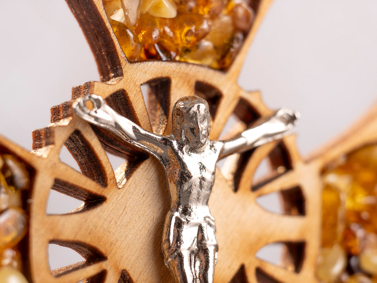 Close-up of the crucifix figure on the wooden cross.