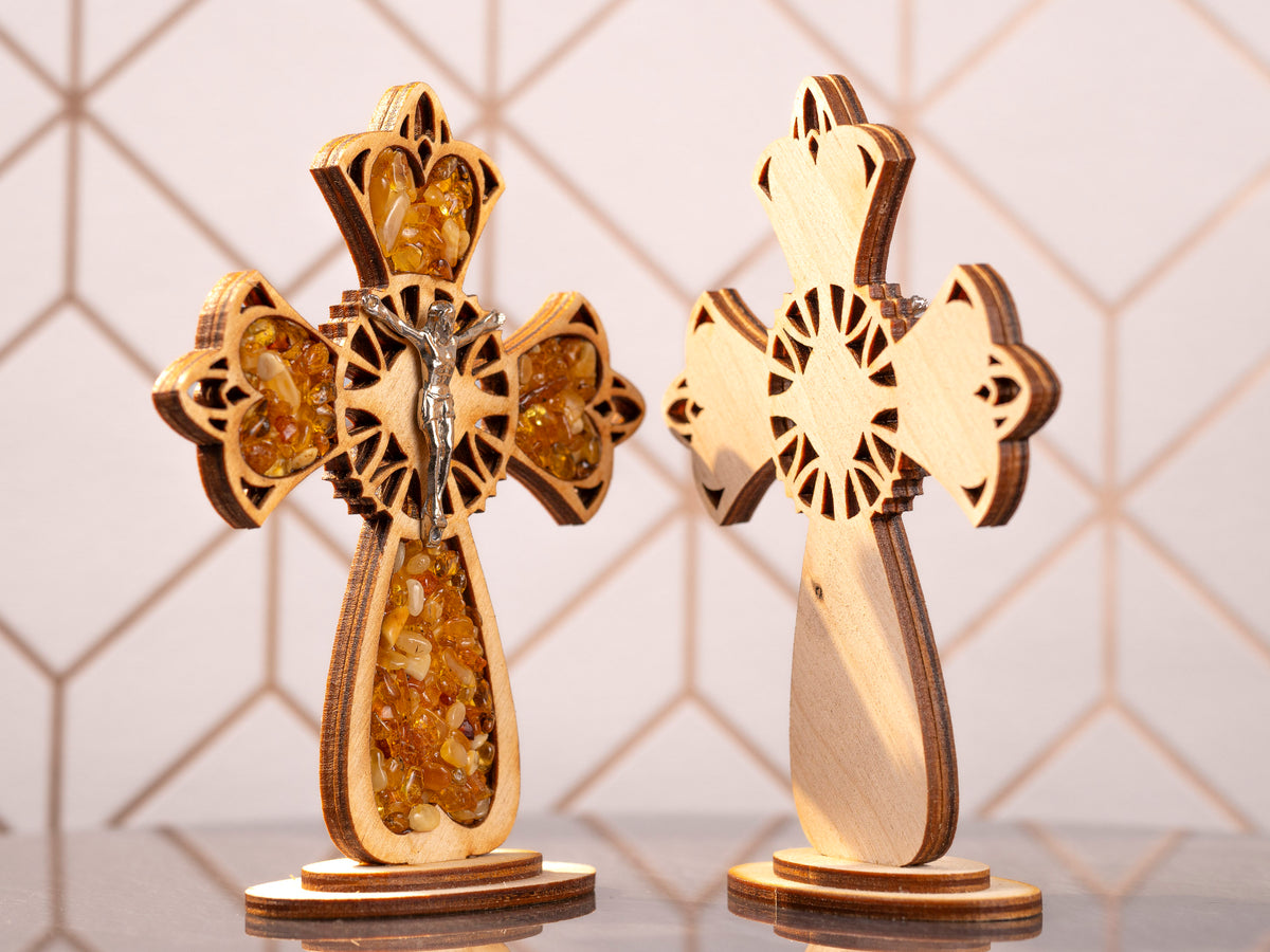 Two standing wooden crosses side by side, one shown from the front and the other from the back.